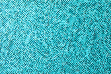 Photo of Texture of turquoise leather as background, closeup