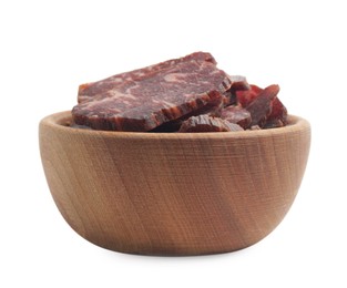 Photo of Delicious beef jerky in wooden bowl isolated on white