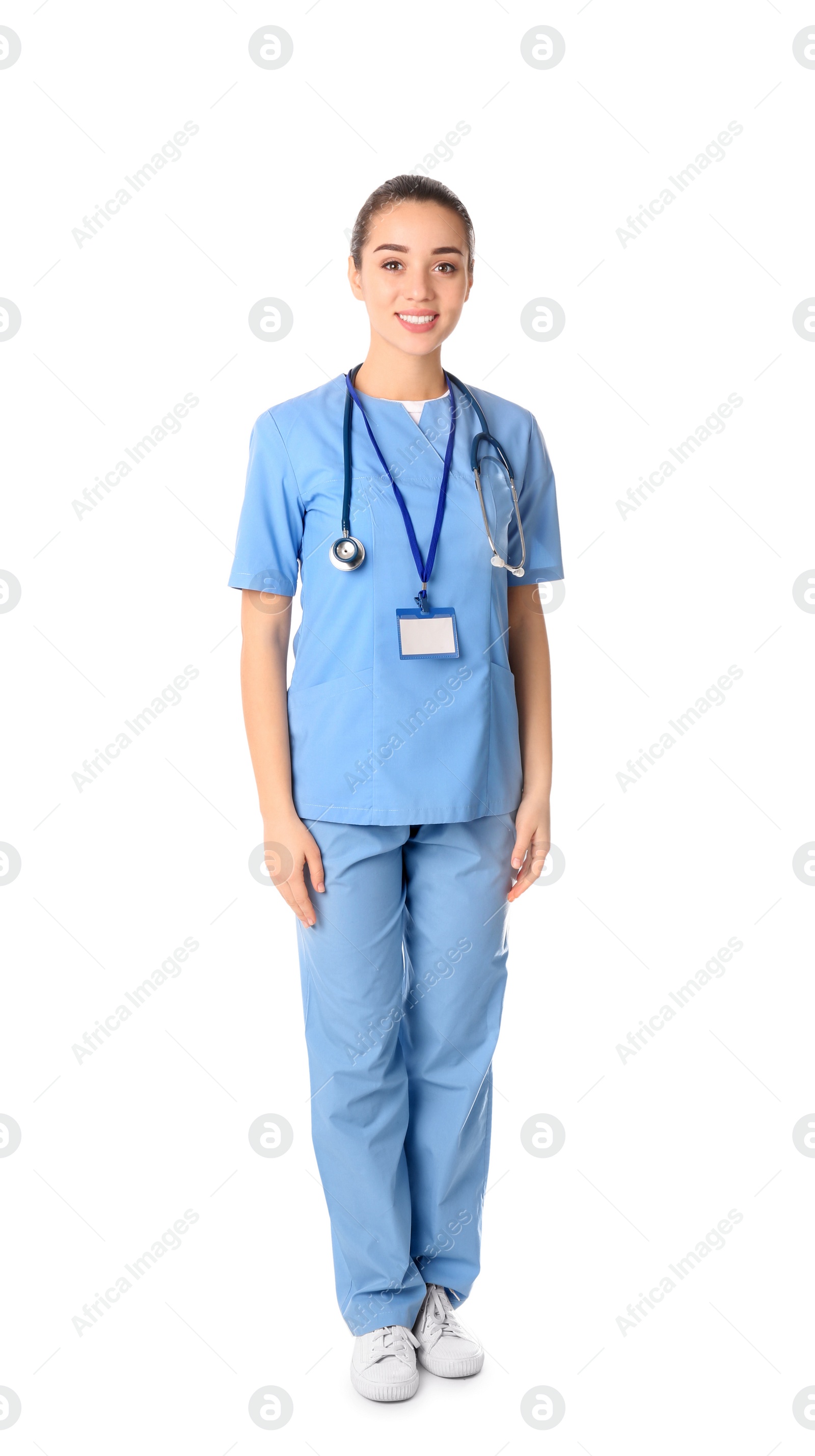 Photo of Young medical student in uniform on white background