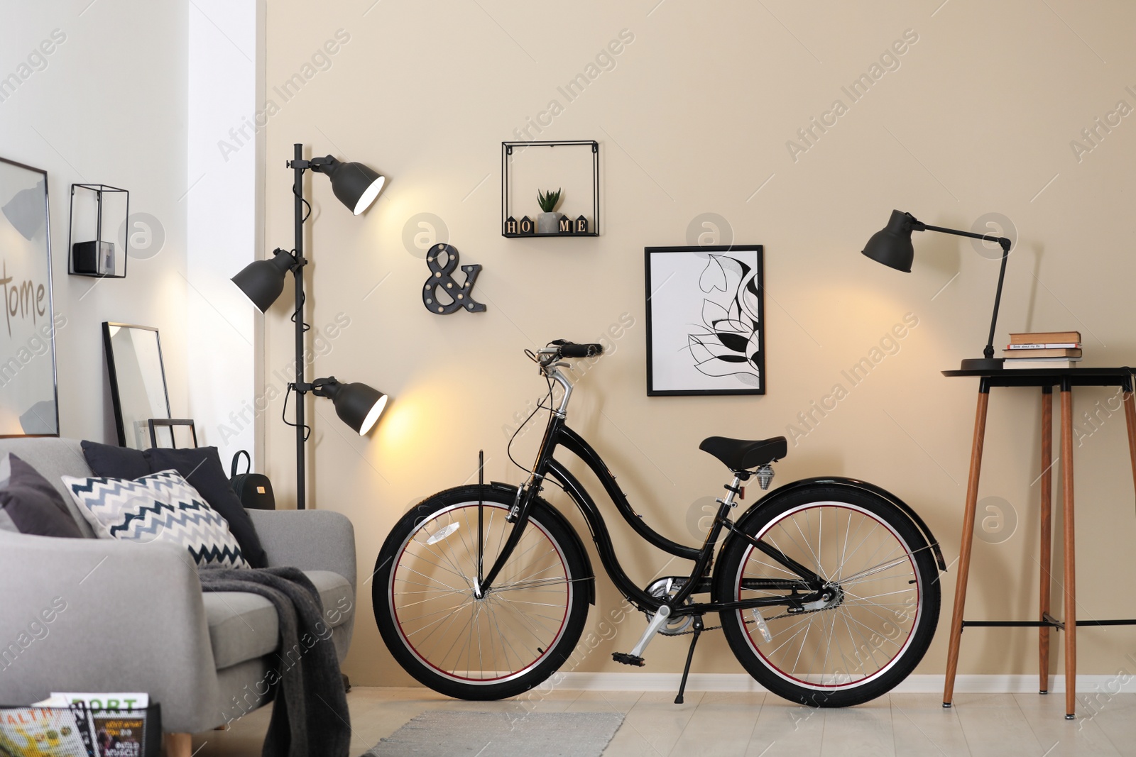 Photo of Modern living room interior with comfortable sofa and bicycle