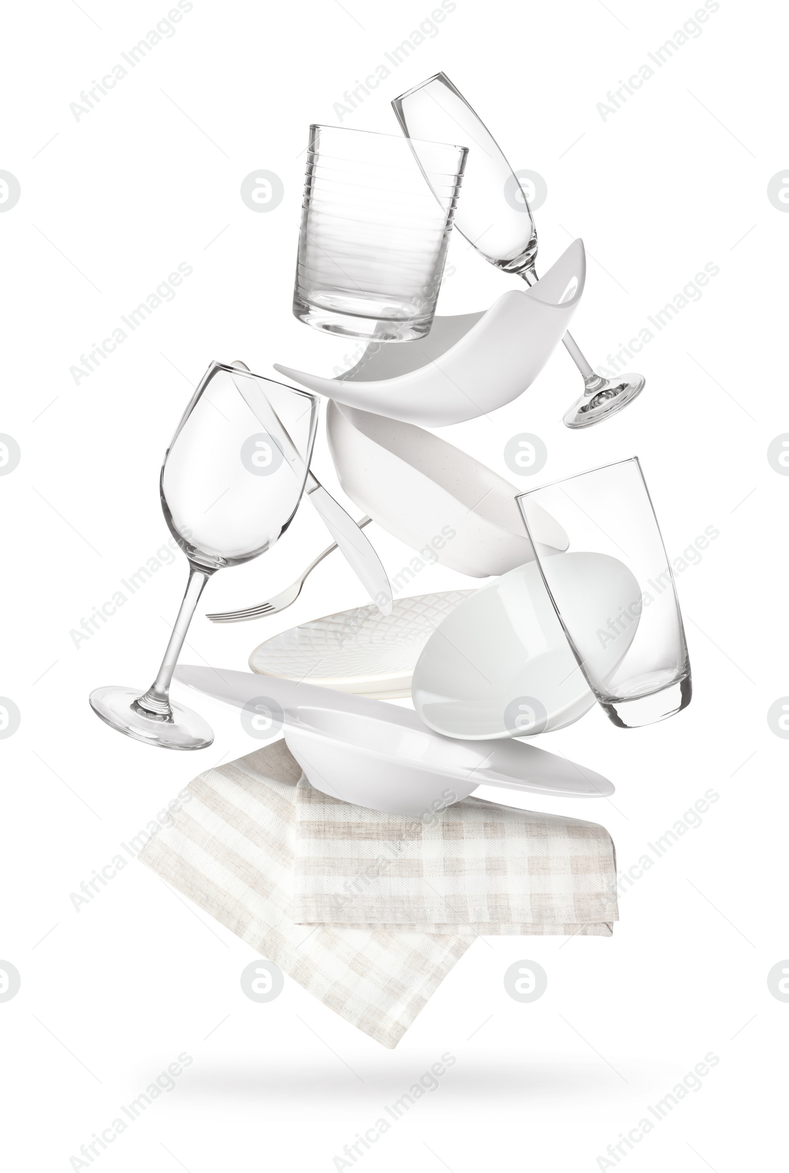 Image of Set of clean tableware and napkin in flight on white background