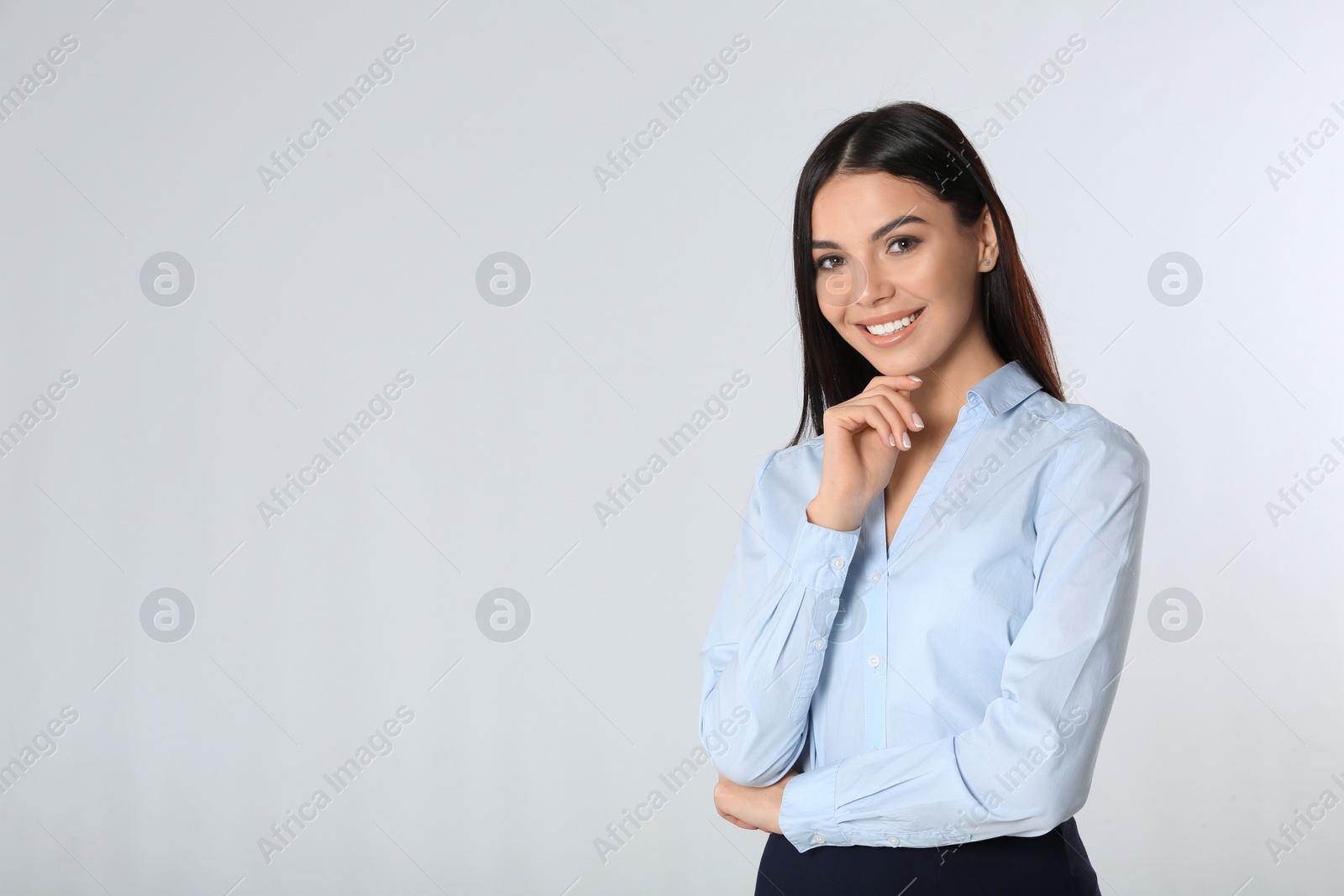 Photo of Portrait of young businesswoman on white background. Space for text