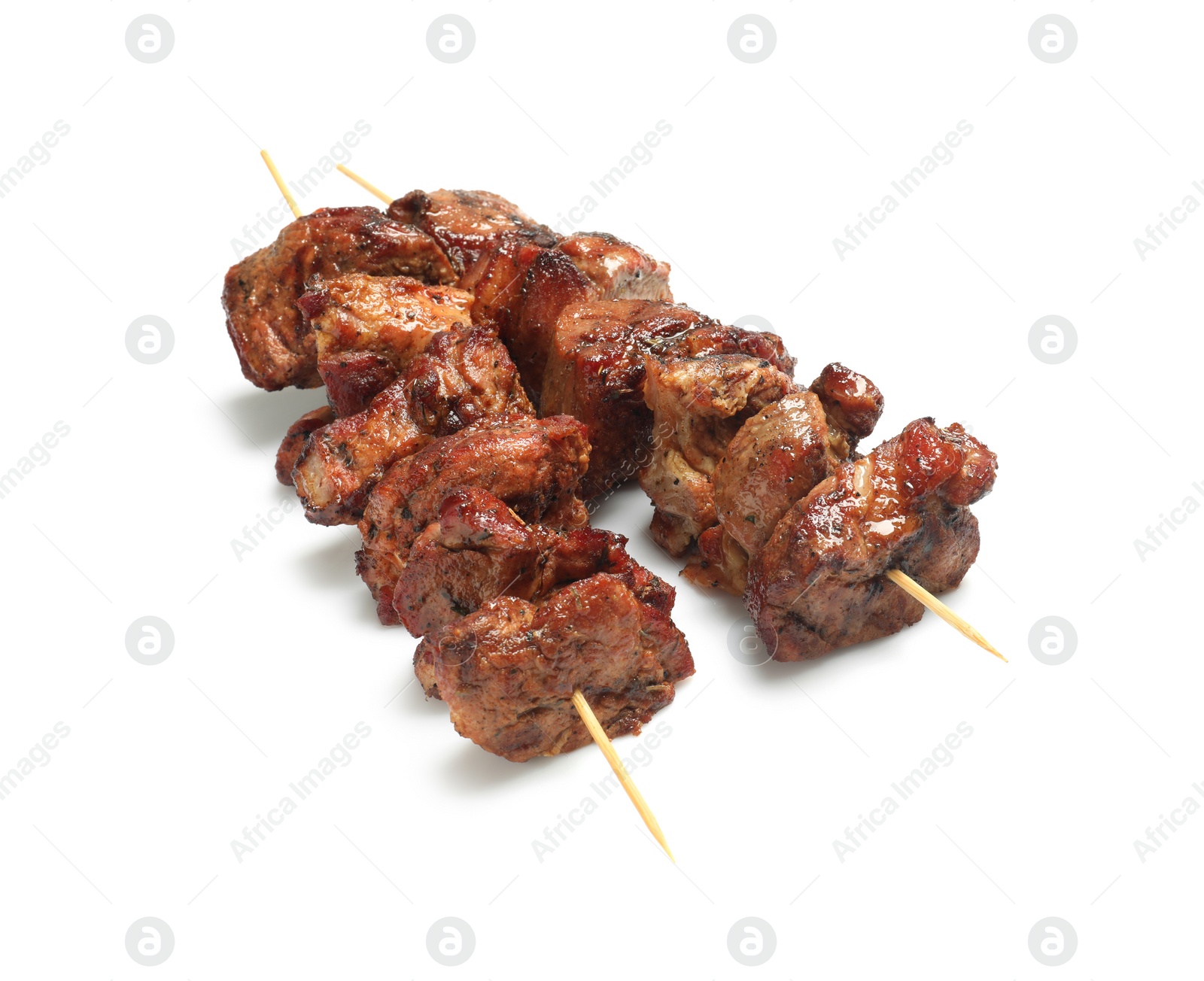 Photo of Wooden skewers with delicious shish kebabs isolated on white