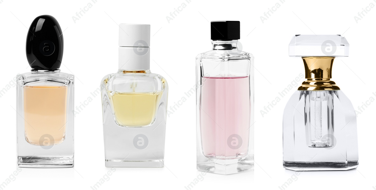 Image of Set with different bottles of perfume on white background