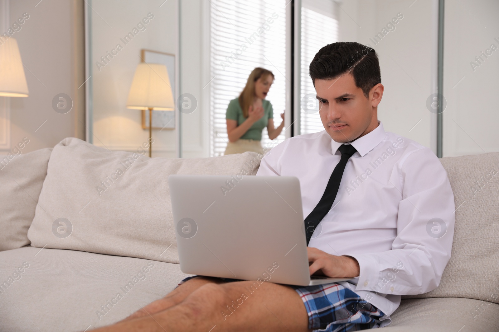 Photo of Man working on laptop indoors. Stay at home concept