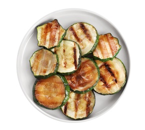 Photo of Plate of delicious grilled zucchini slices on white background, top view