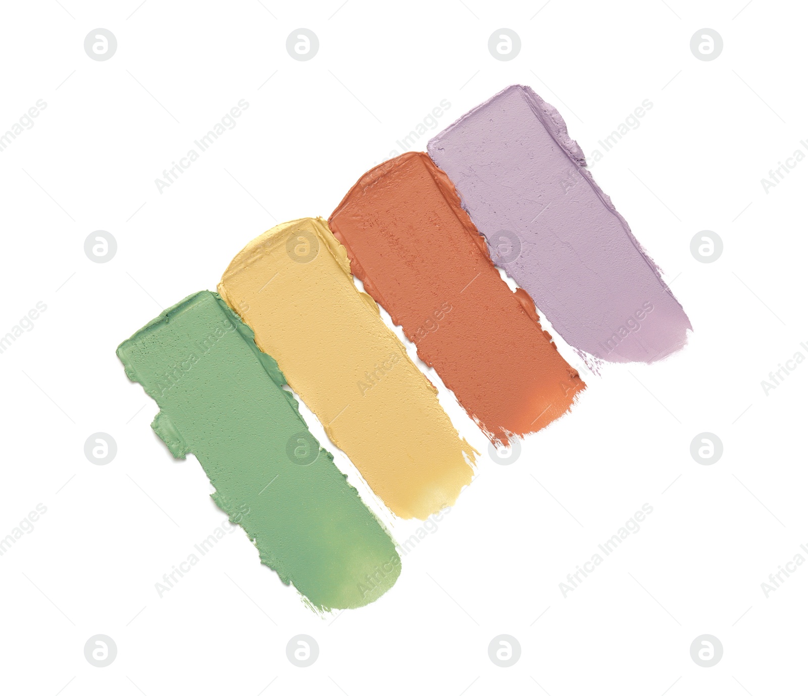 Photo of Samples of color correcting concealers isolated on white, top view