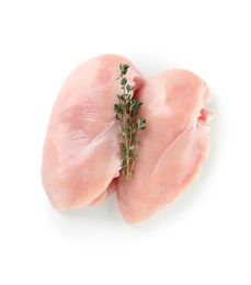Photo of Raw chicken breasts with thyme on white background, top view. Fresh meat