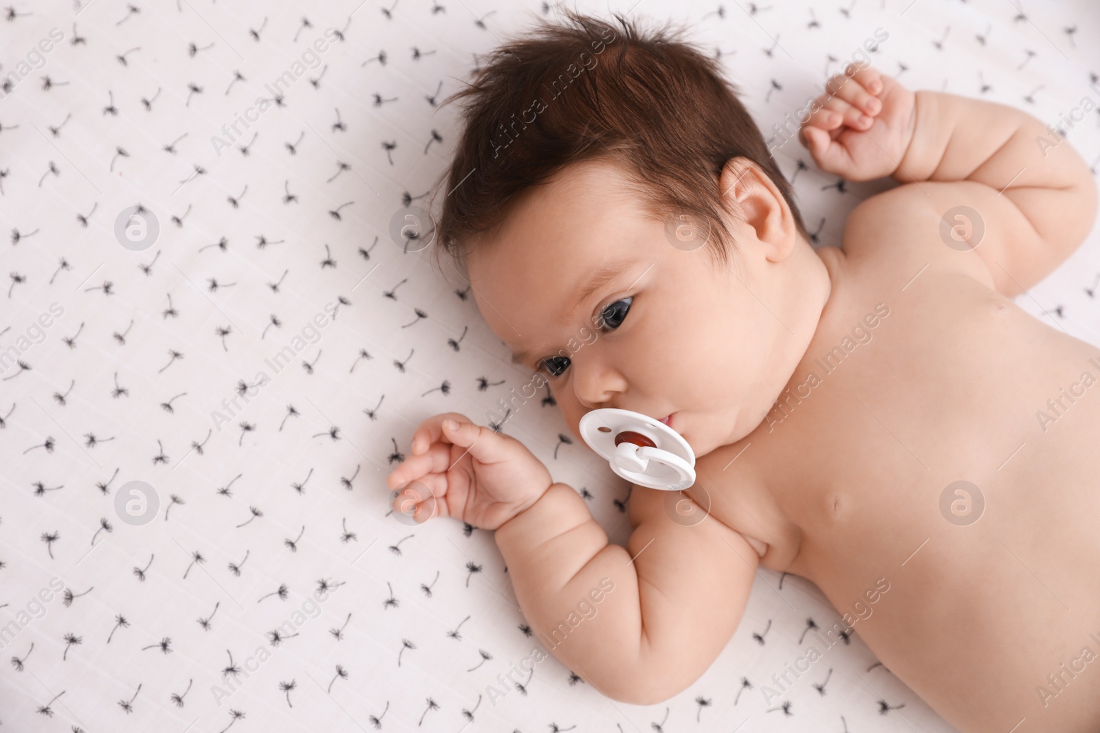 Photo of Cute little baby lying on blanket, top view with space for text. Bedtime