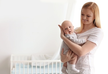 Happy mother and her baby at home