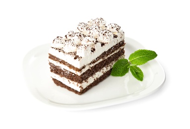 Photo of Plate of tiramisu cake with mint isolated on white