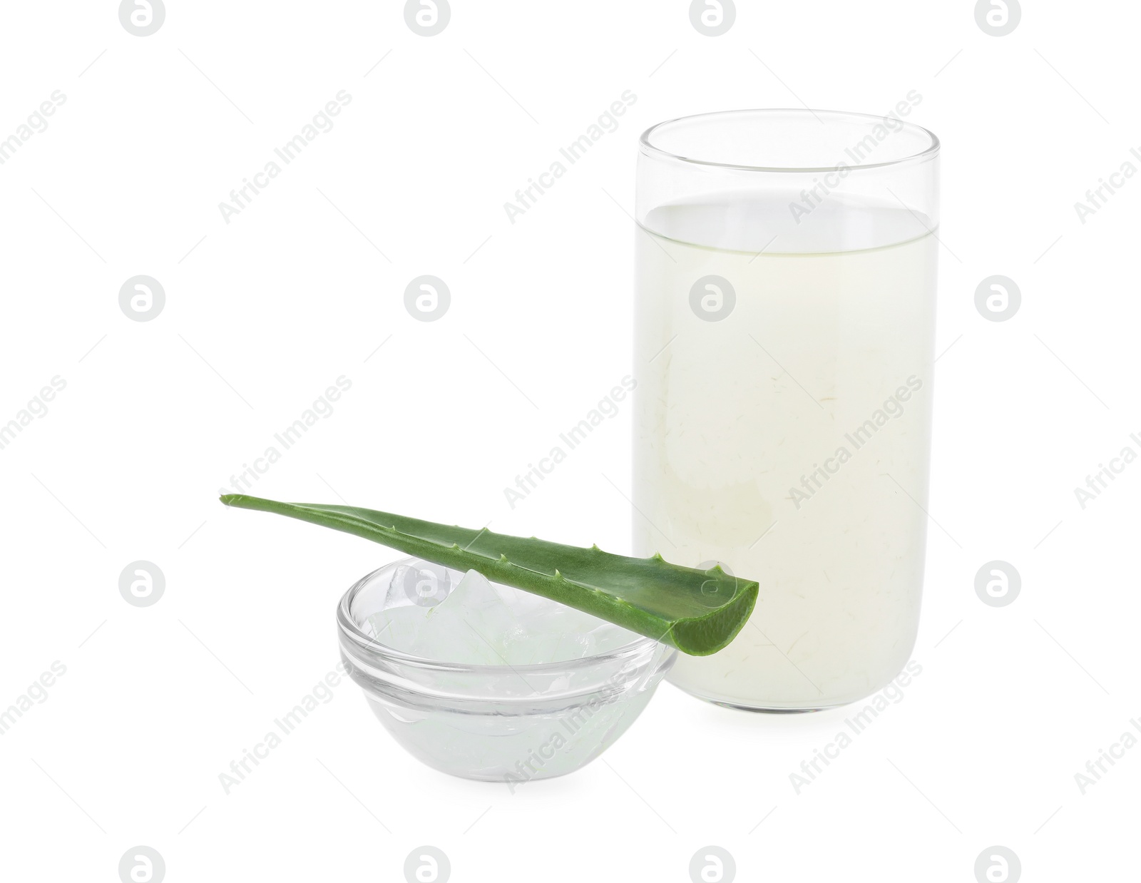 Photo of Tasty aloe juice in glass, pulp and fresh leaf isolated on white