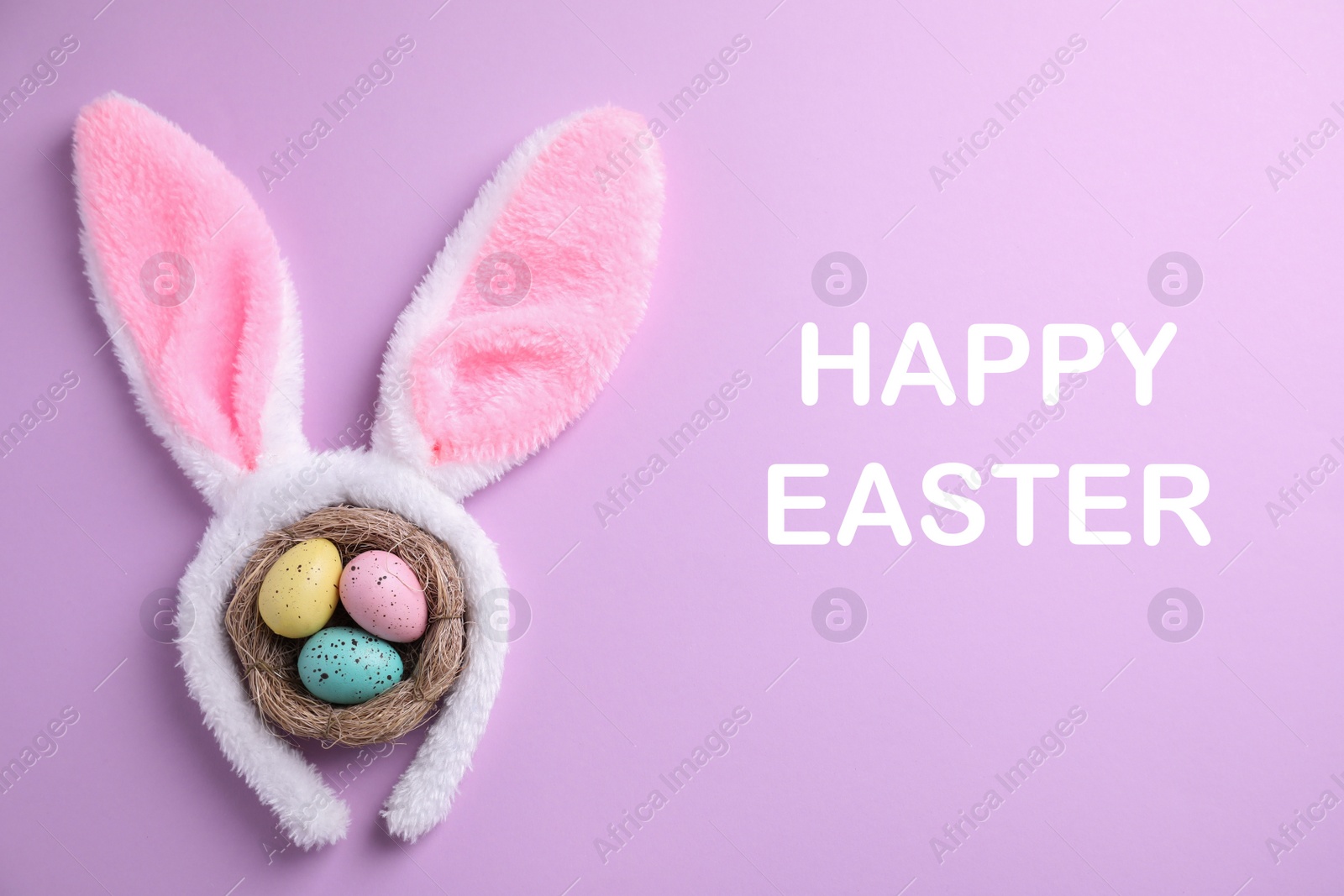 Image of Easter bunny ears headband and dyed eggs in nest on lilac background, flat lay