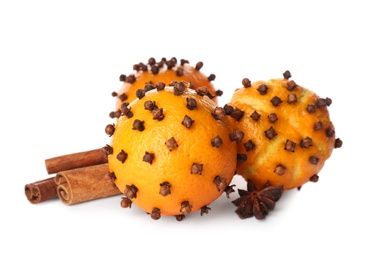 Photo of Pomander balls made of fresh tangerines and cloves on white background