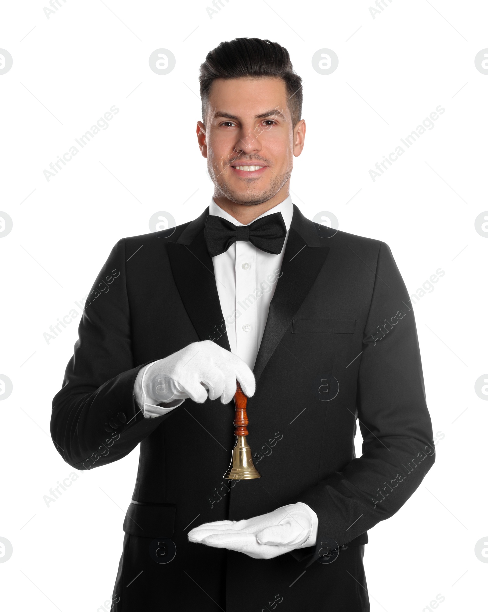 Photo of Handsome butler holding hand bell on white background