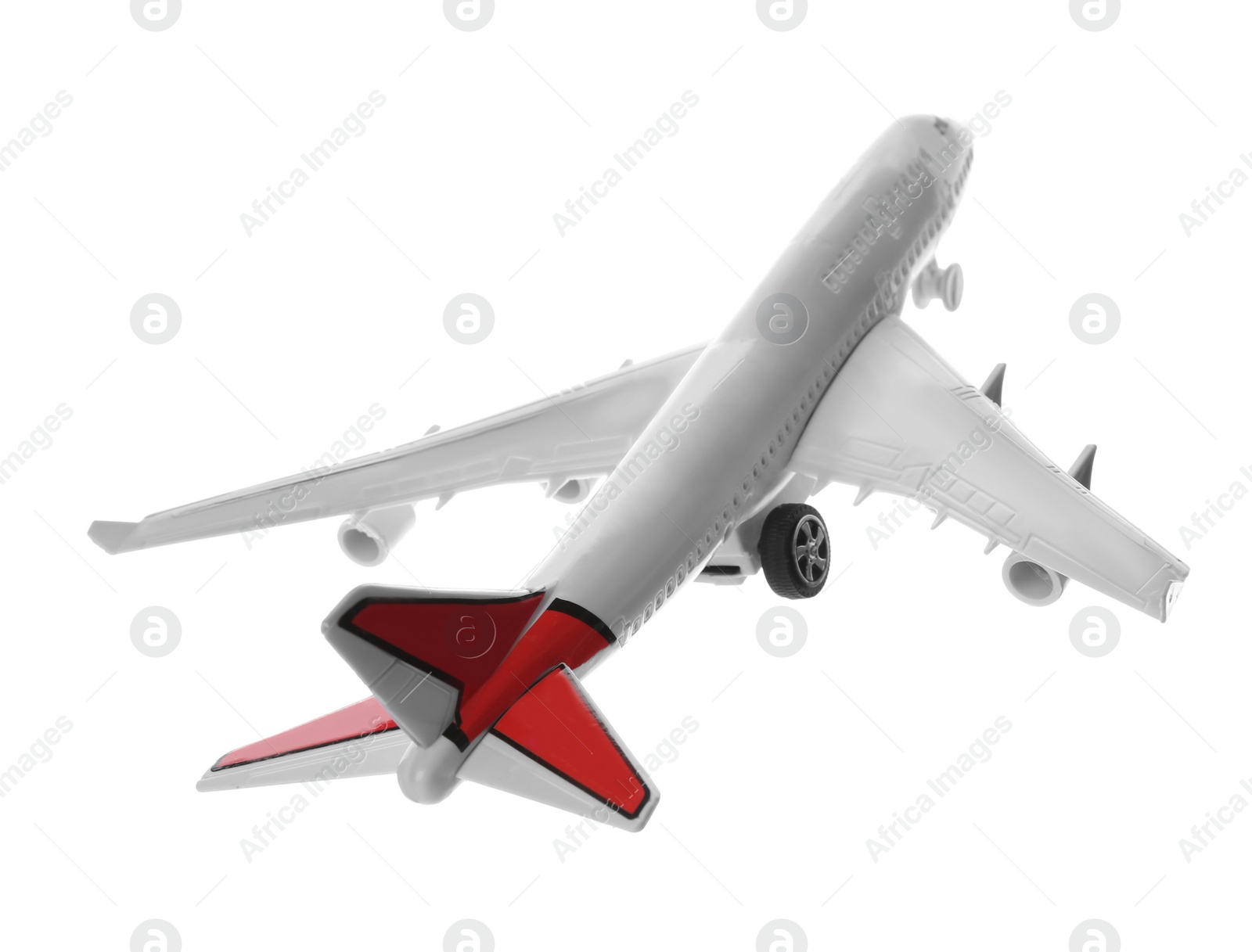 Photo of Toy airplane isolated on white. Travel concept