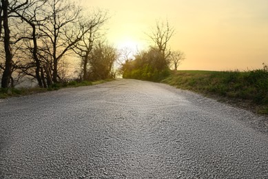 Asphalt road in countryside on sunny day