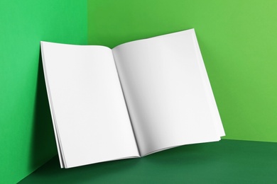 Photo of Empty book pages on color background. Mockup for design