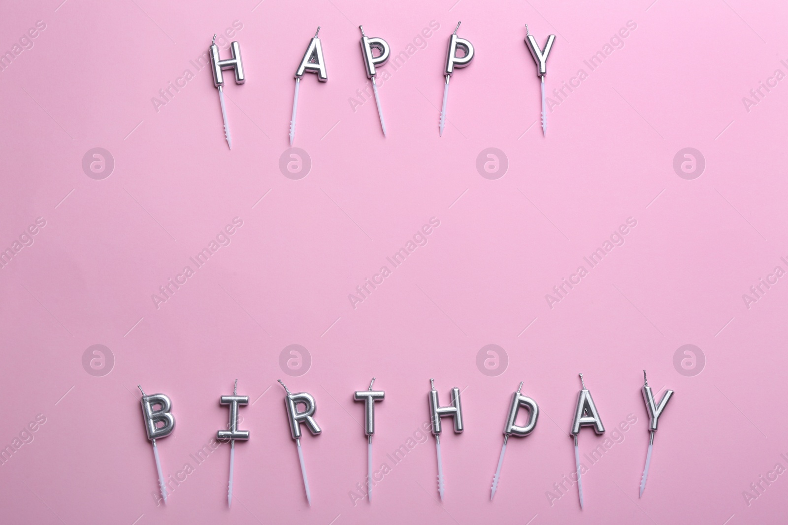 Photo of Flat lay composition with birthday candles on color background. Space for text