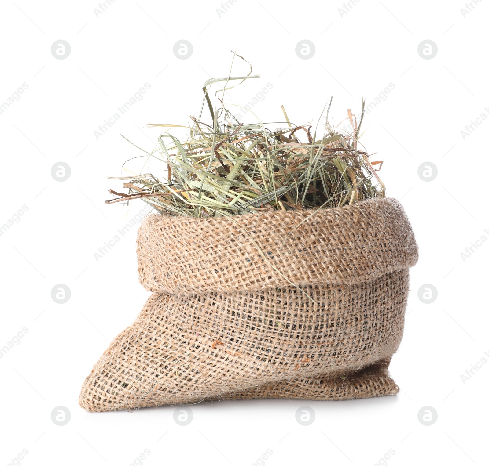 Photo of Dried hay in burlap sack isolated on white