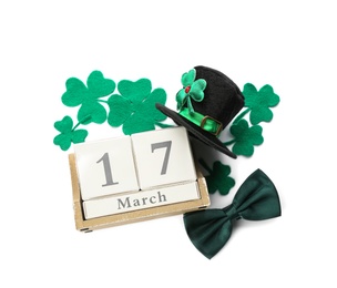 Leprechaun's hat, block calendar and St. Patrick's day decor on white background, top view