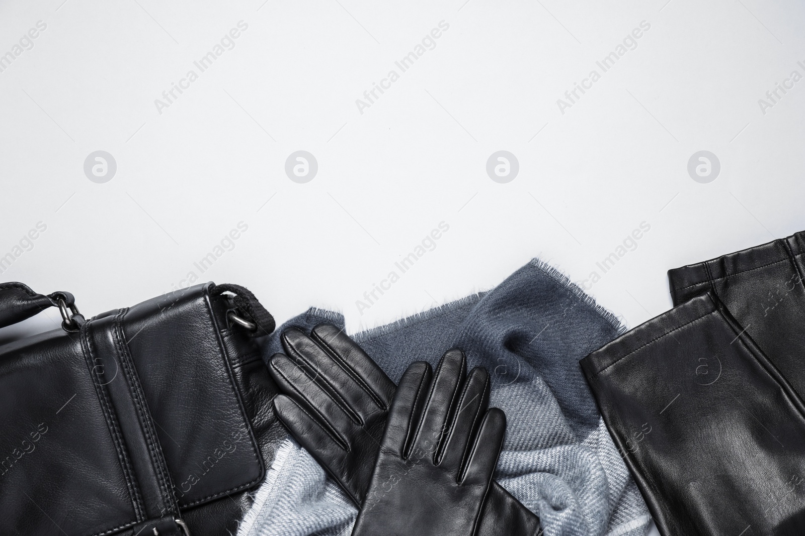 Photo of Stylish leather accessories on white background, top view