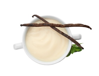 Vanilla pudding, sticks and fresh mint on white background