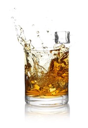 Photo of Whiskey splashing out of glass on white background