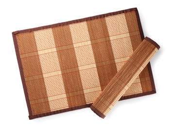 Photo of Sushi mats made of bamboo on white background, top view