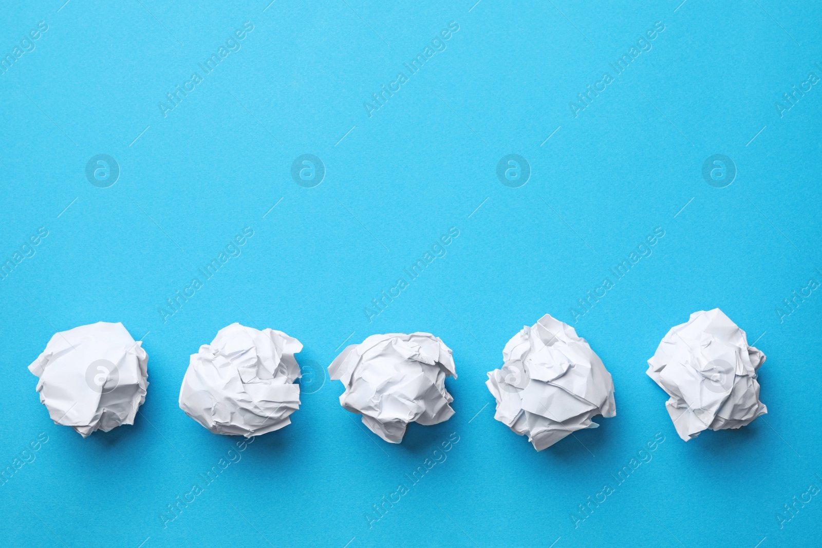 Photo of Crumpled sheets of paper on color background, flat lay. Space for text