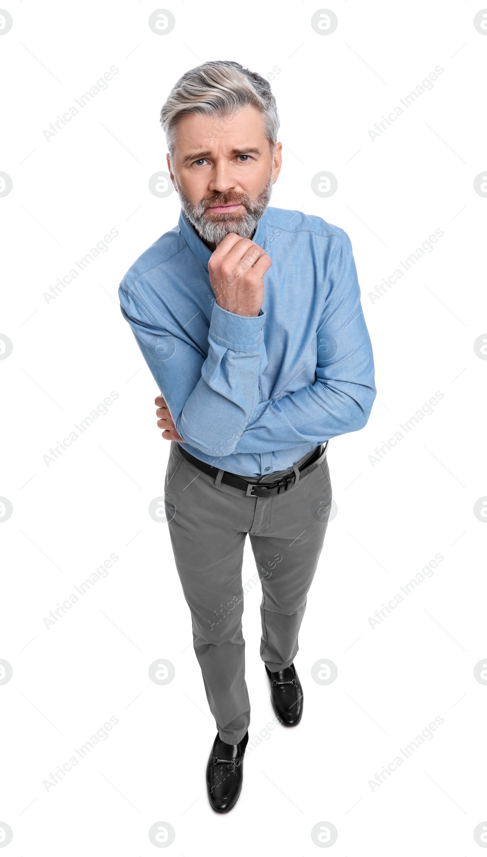 Photo of Mature businessman in stylish clothes posing on white background