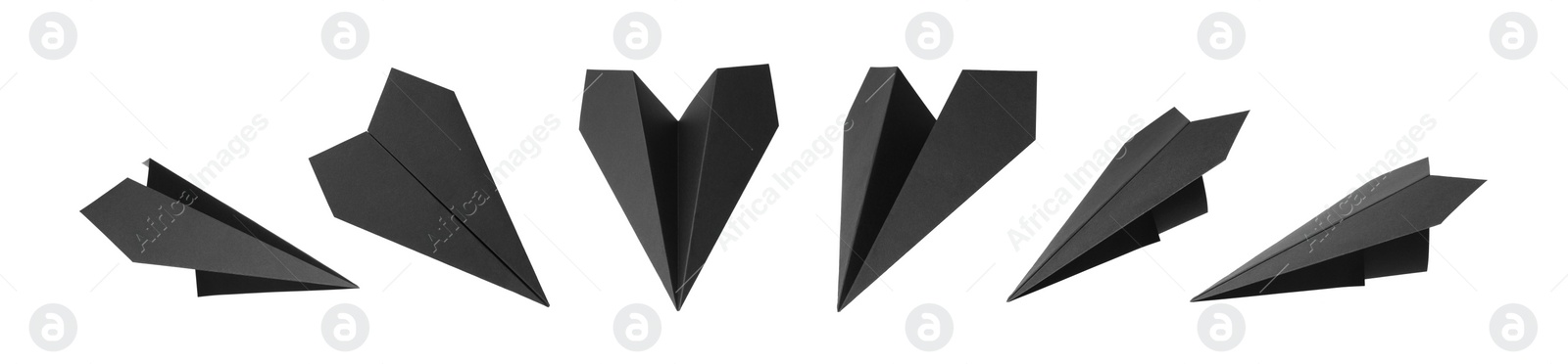 Image of Set with handmade black paper planes on white background. Banner design