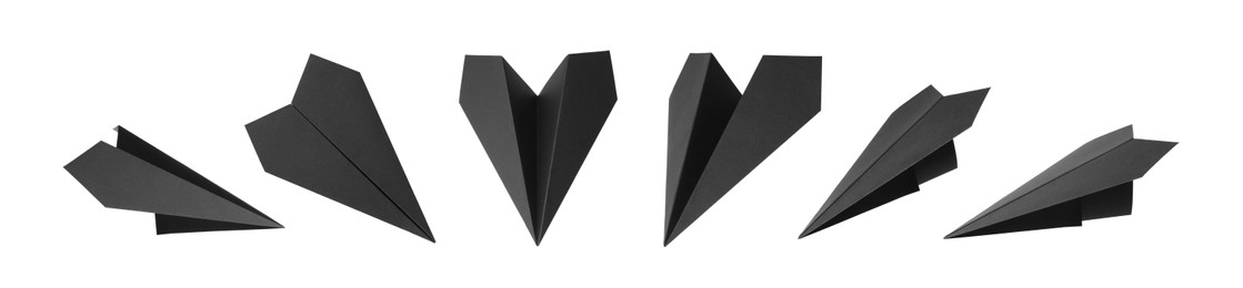 Image of Set with handmade black paper planes on white background. Banner design