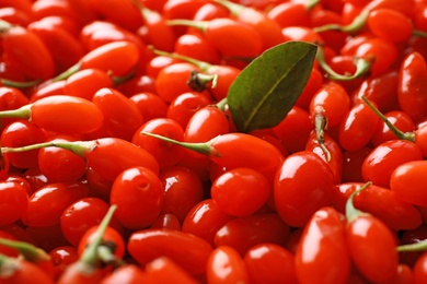 Fresh ripe goji berries as background, closeup