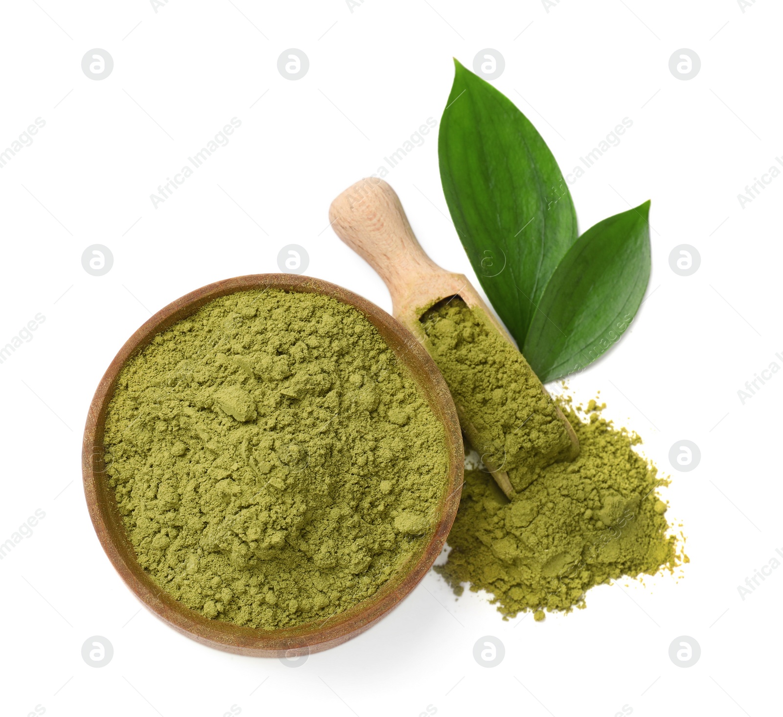 Photo of Henna powder in bowl, scoop and green leaves isolated on white, top view