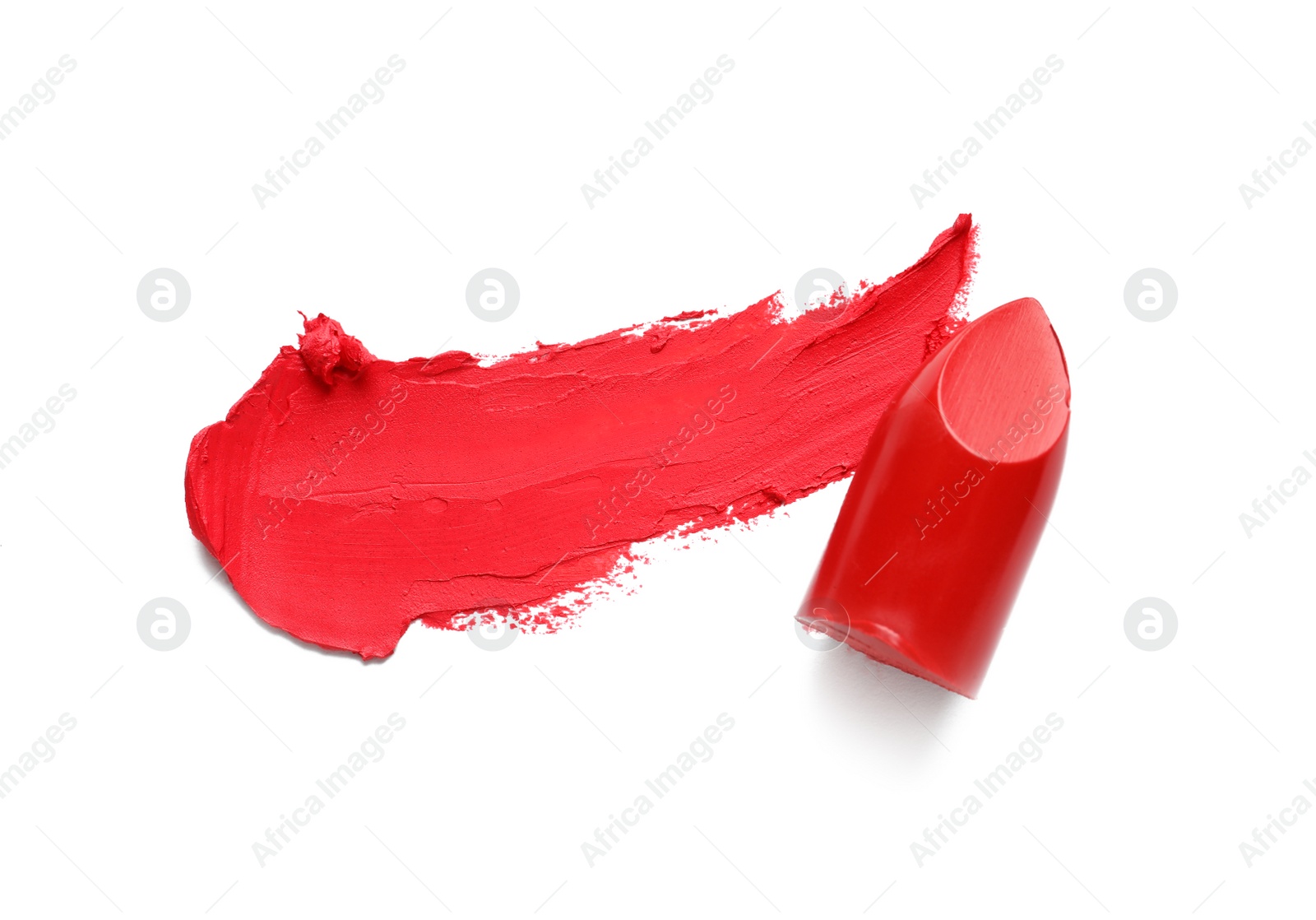 Photo of Stroke and lipstick on white background, top view