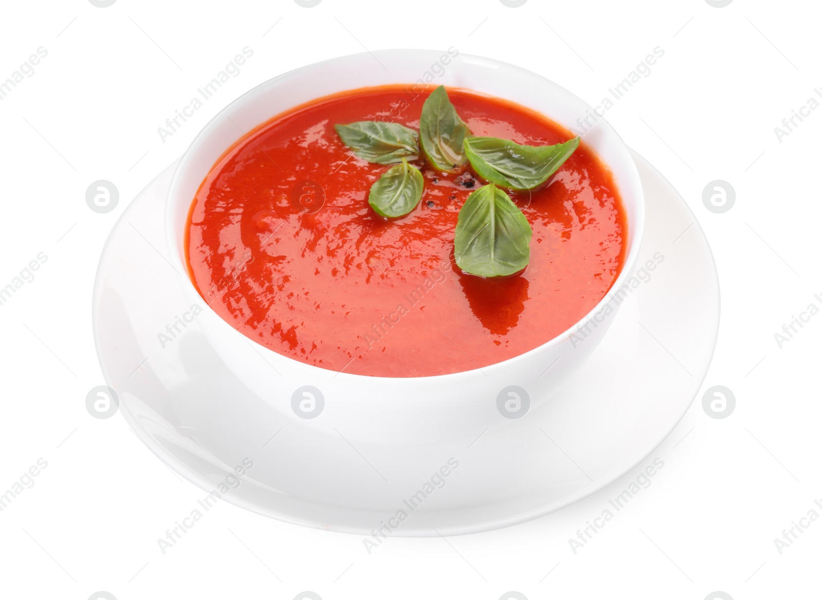 Photo of Delicious tomato cream soup in bowl isolated on white