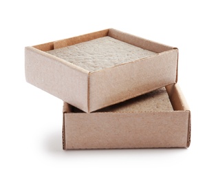 Hand made soap bars in cardboard packages on white background