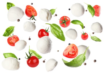 Mozzarella cheese balls, tomatoes, basil leaves and peppercorns for caprese salad flying on white background