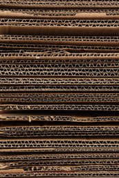 Photo of Sheets of brown corrugated cardboard as background, closeup