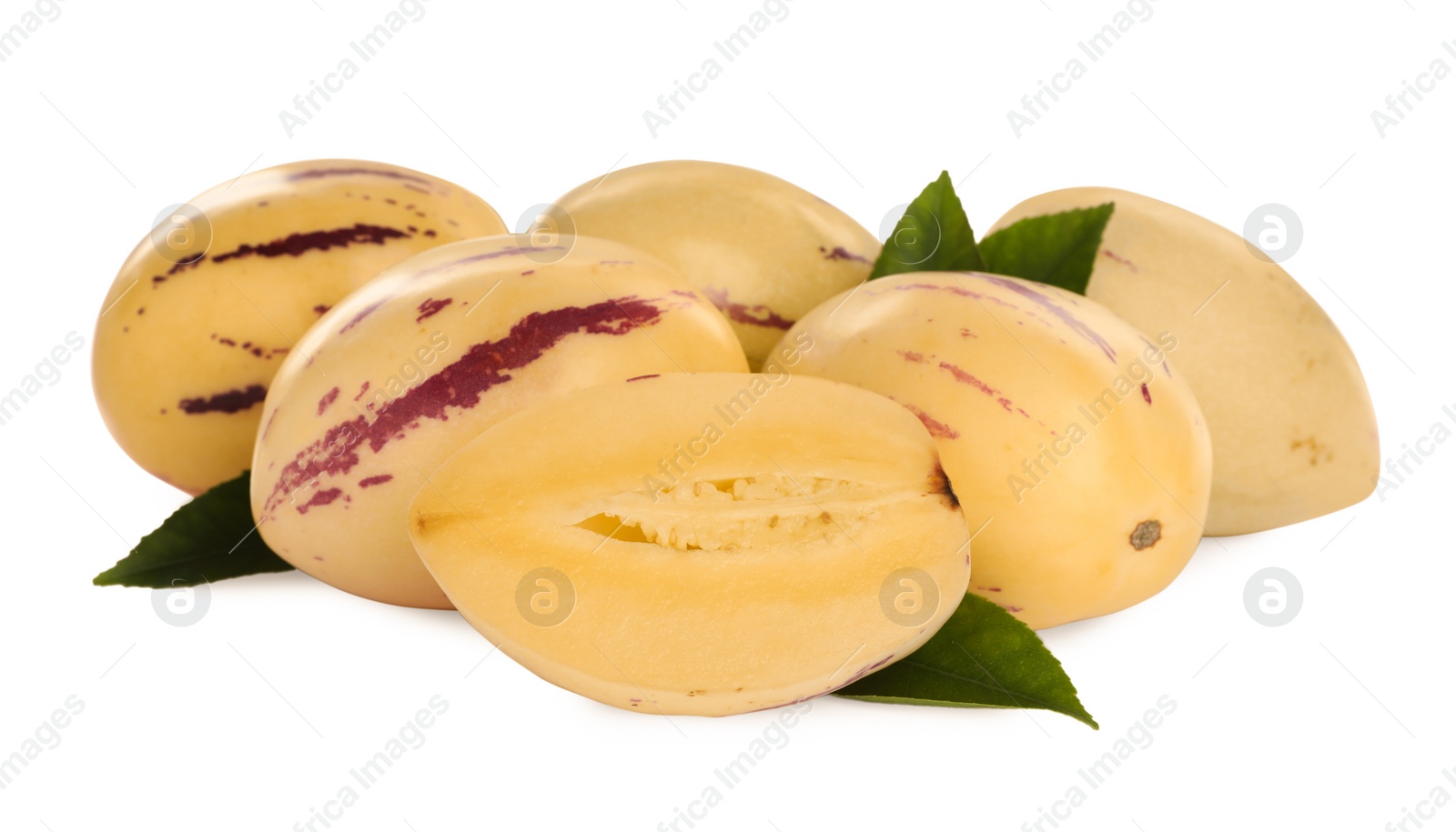 Photo of Fresh ripe pepino melons with green leaves on white background