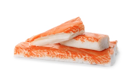 Photo of Fresh delicious crab sticks on white background