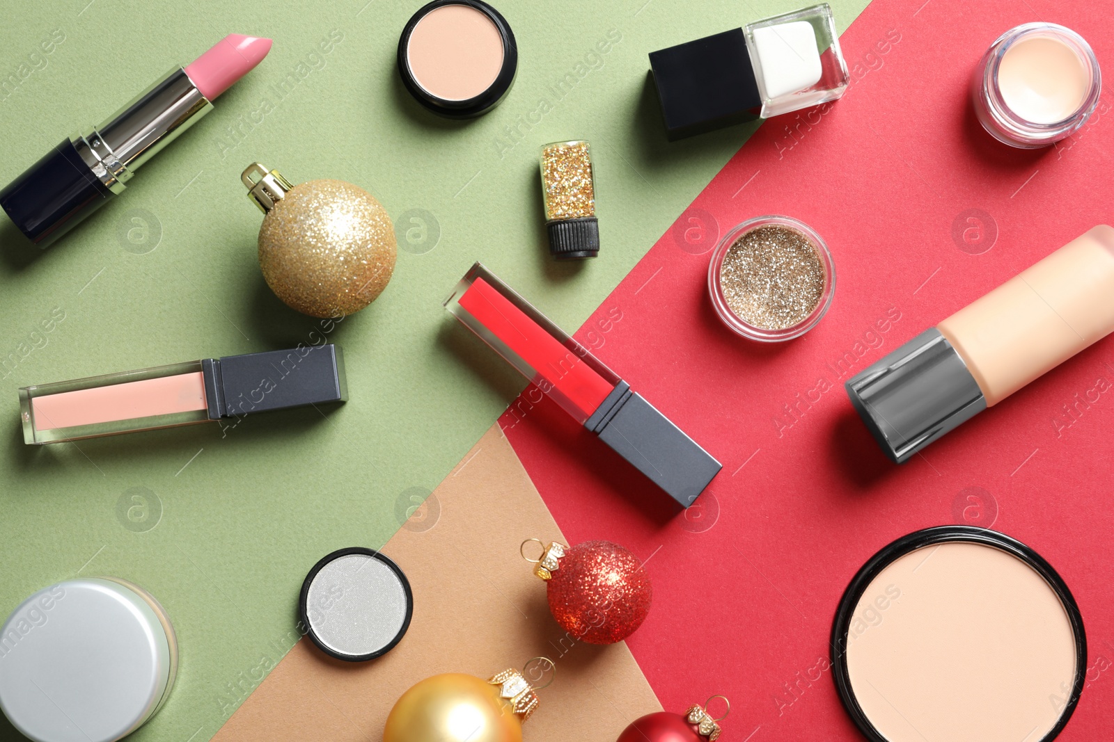 Photo of Flat lay composition with makeup products and Christmas decor on color background