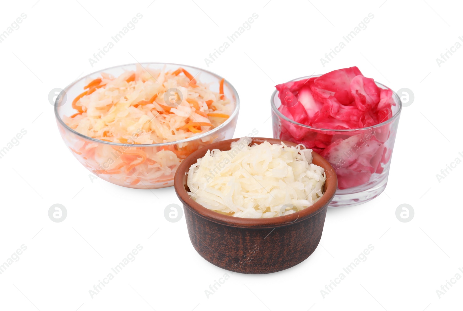 Photo of Delicious sauerkraut prepared according to different recipes on white background