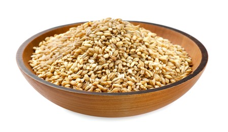 Dry pearl barley in bowl isolated on white