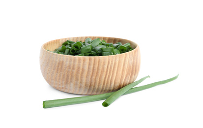 Cut green spring onion in wooden bowl isolated on white