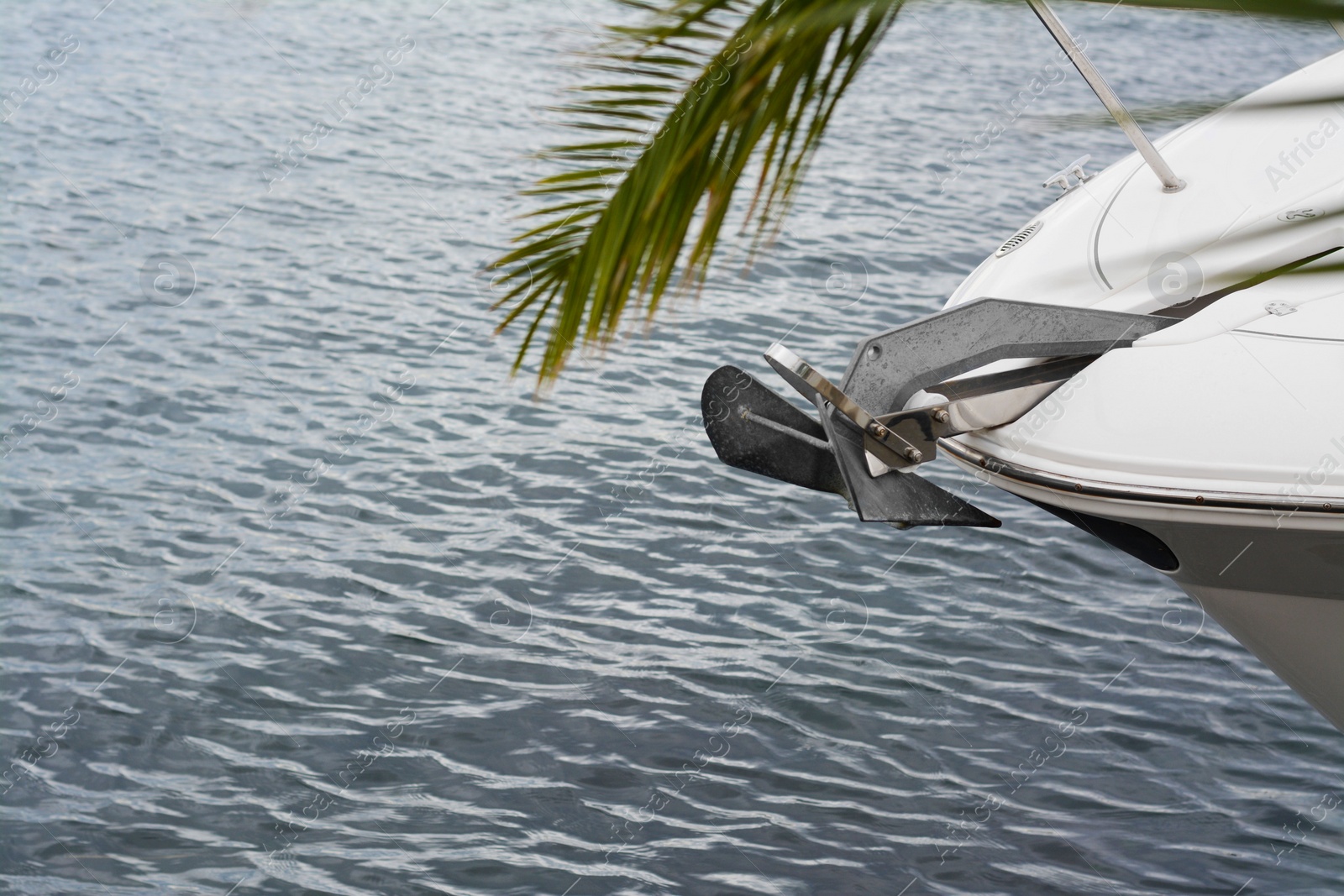 Photo of Huge and massive anchor of modern yacht moored in harbor near sea