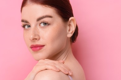 Photo of Portrait of beautiful woman on pink background, closeup. Space for text