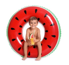 Cute little boy with inflatable ring and glass of cocktail on white background