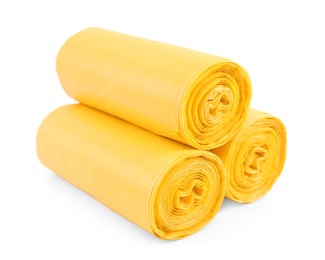 Photo of Rolls of yellow garbage bags isolated on white